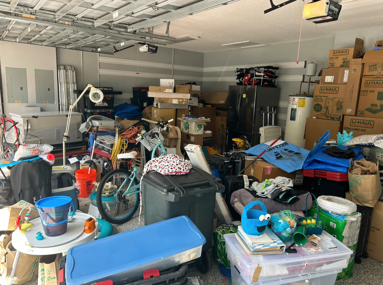 Garage filled with stored items before a property cleanout