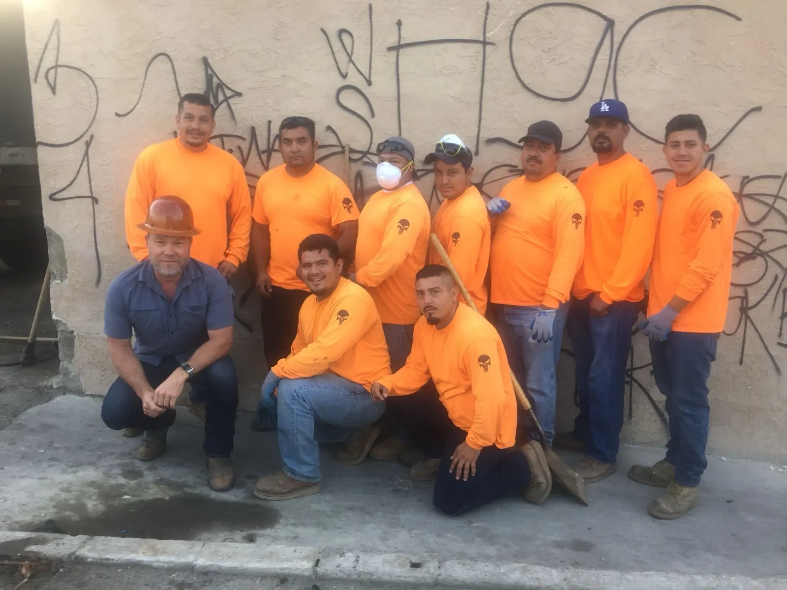 Our crew lined up in company shirts outside a job